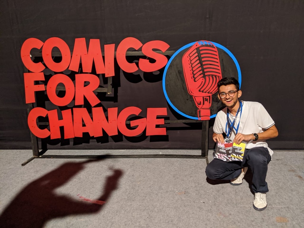 At the Comics for Change event backdrop