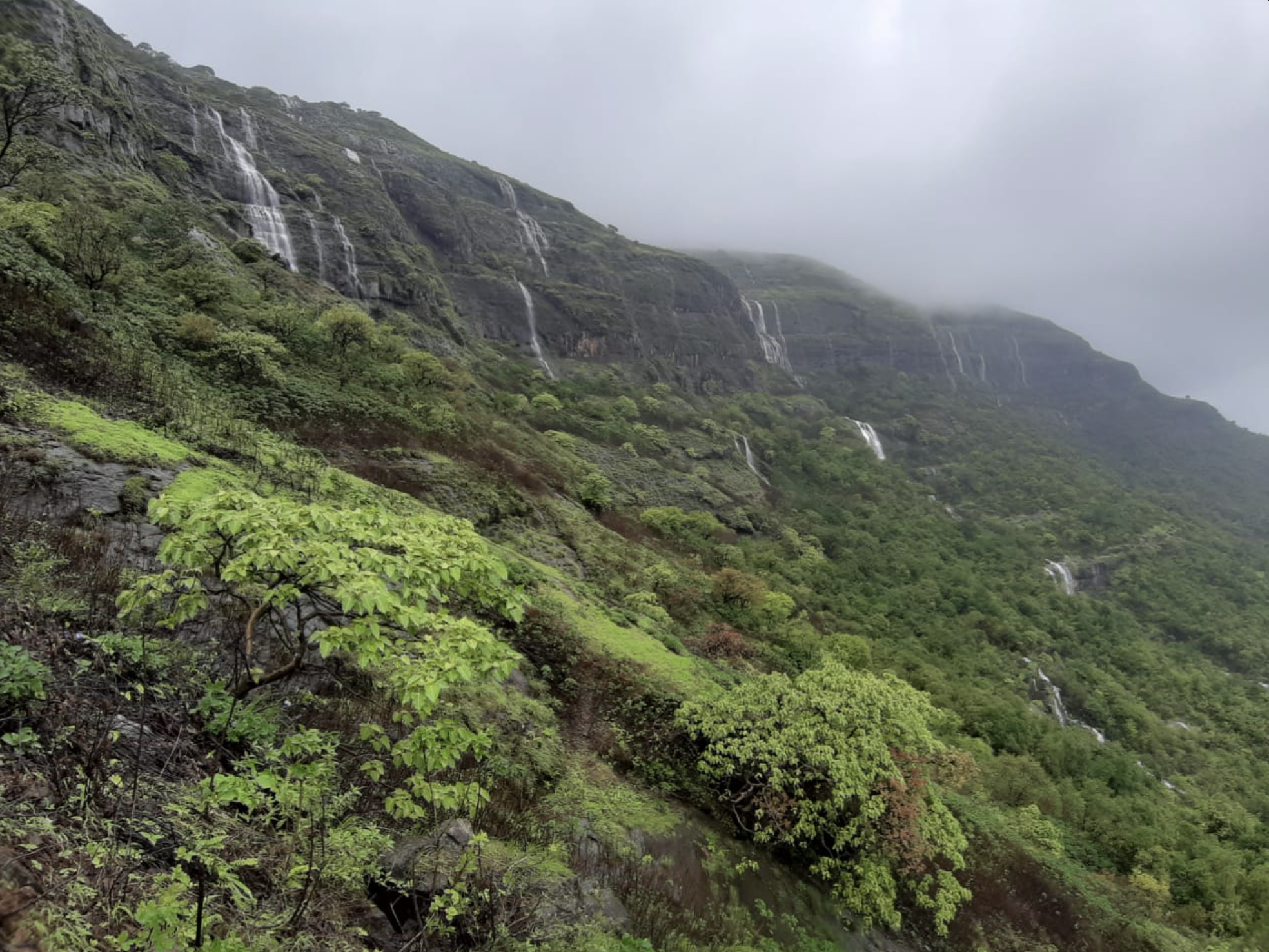 Waterfalls cascading down the Kalsubai range in monsoon